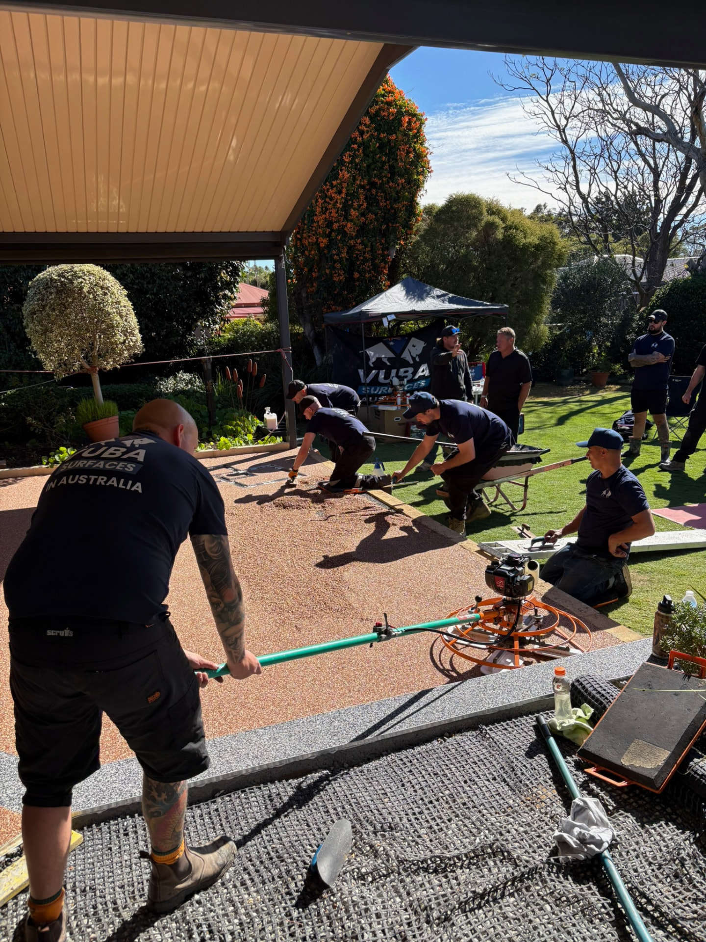 Vuba Surfaces Australia team laying resin bound patio during training
