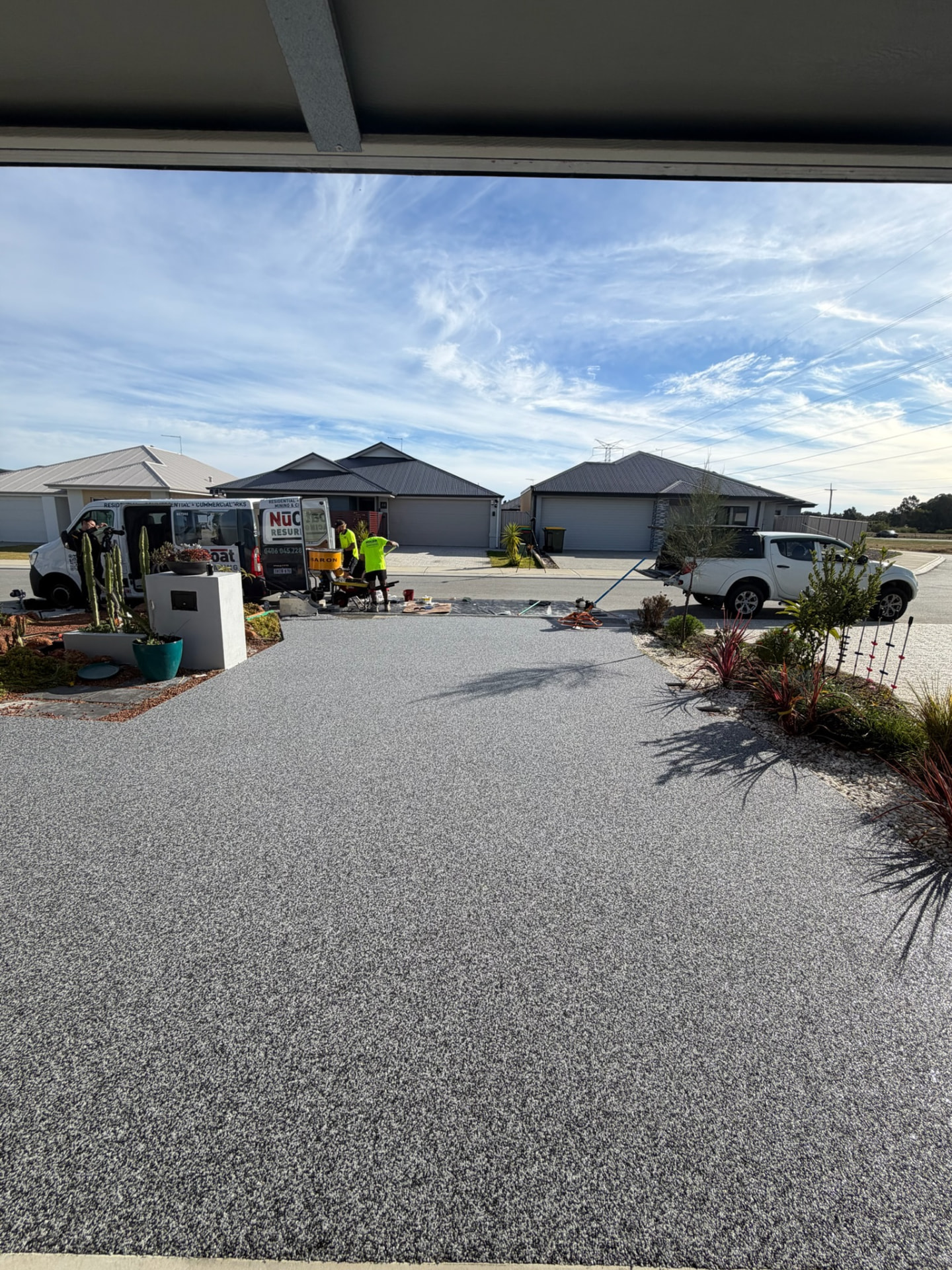 Grey resin bound driveway Perth being installed by Vuba team