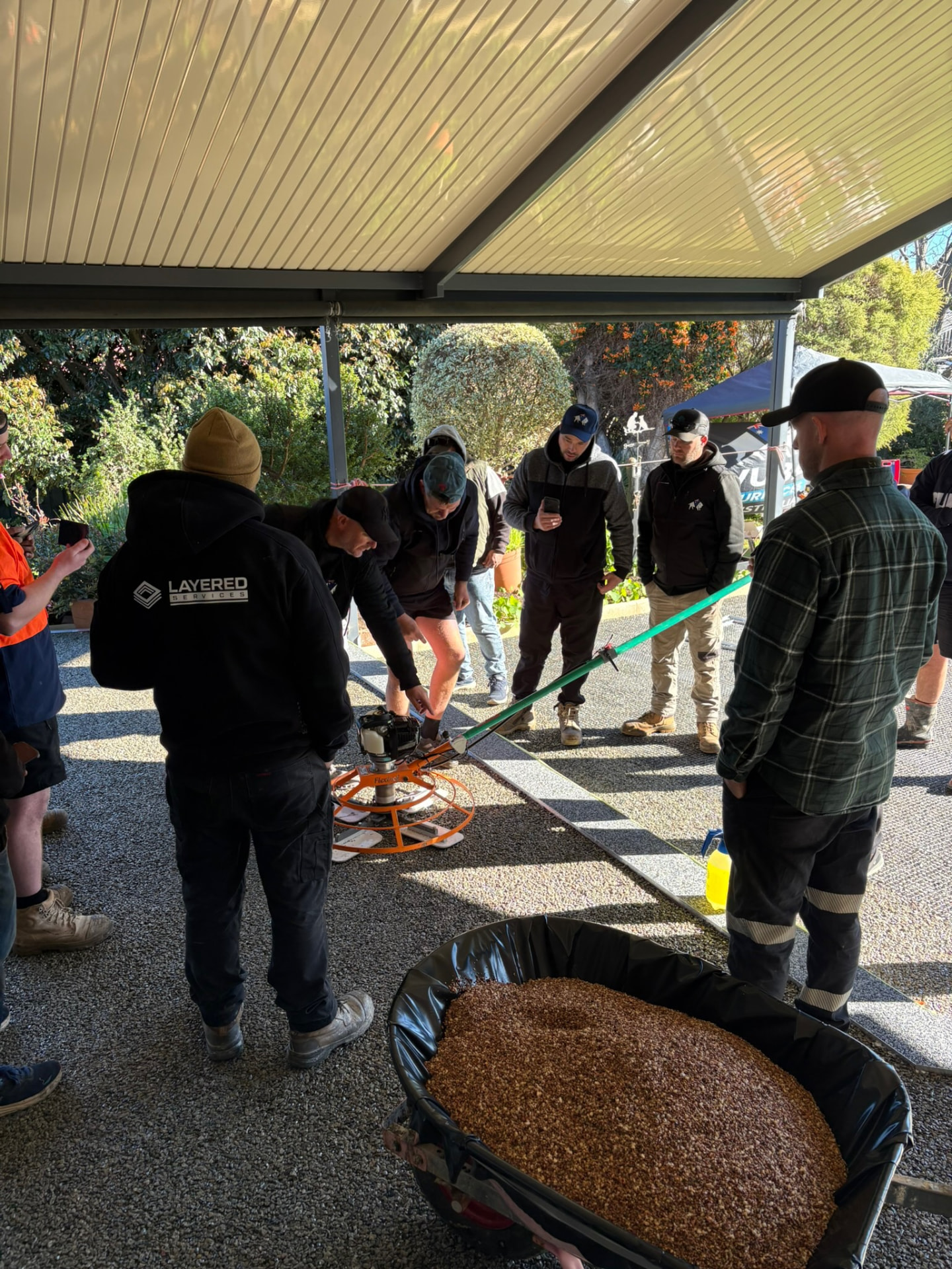 Vuba training group watching power trowel demonstration Perth