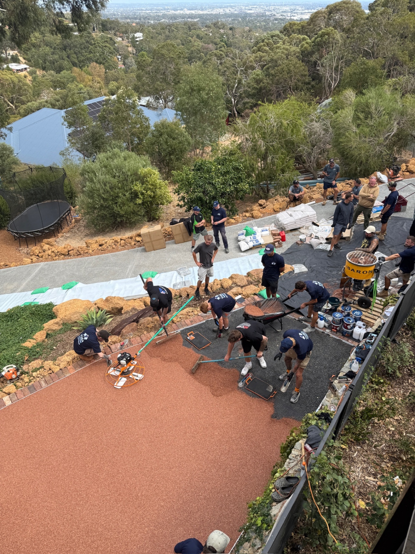 Aerial view of team installing resin surface