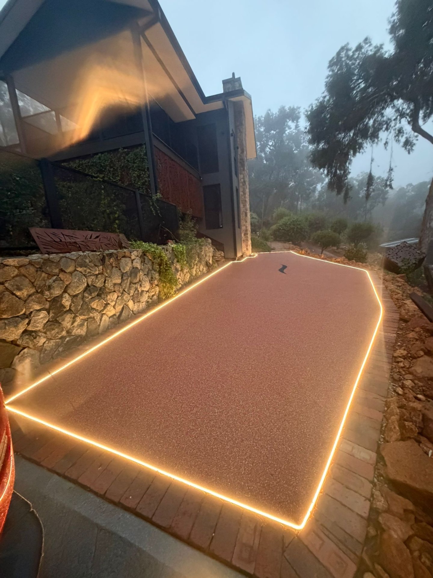Illuminated resin pathway leading to home