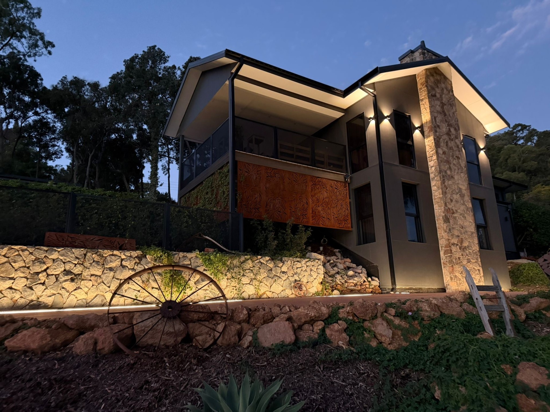 Modern home with resin driveway and stone features
