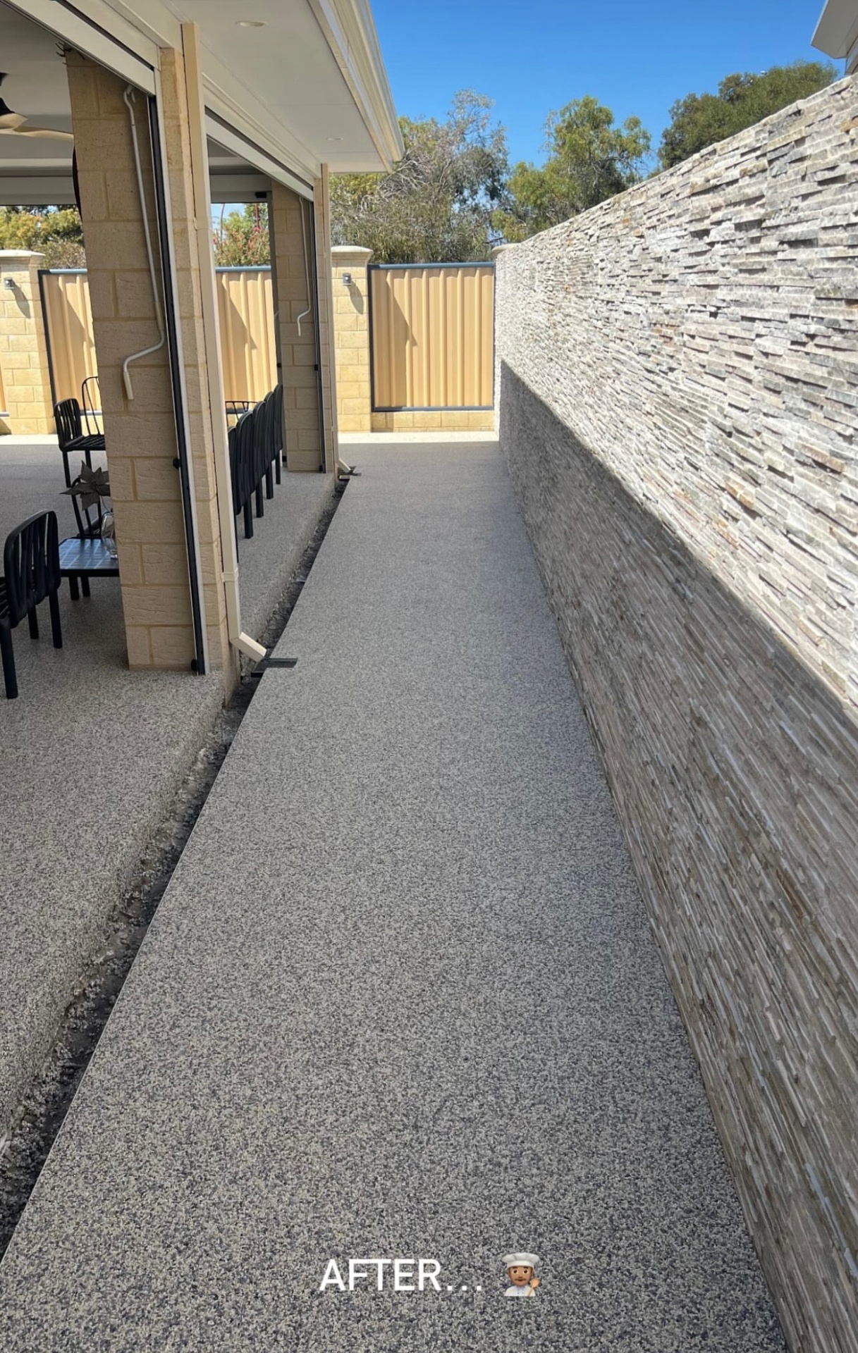 Resin bound pathway alongside stone wall