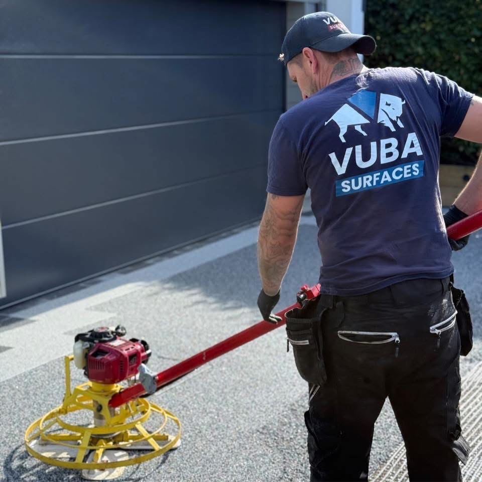 Vuba Surfaces installer with power trowel
