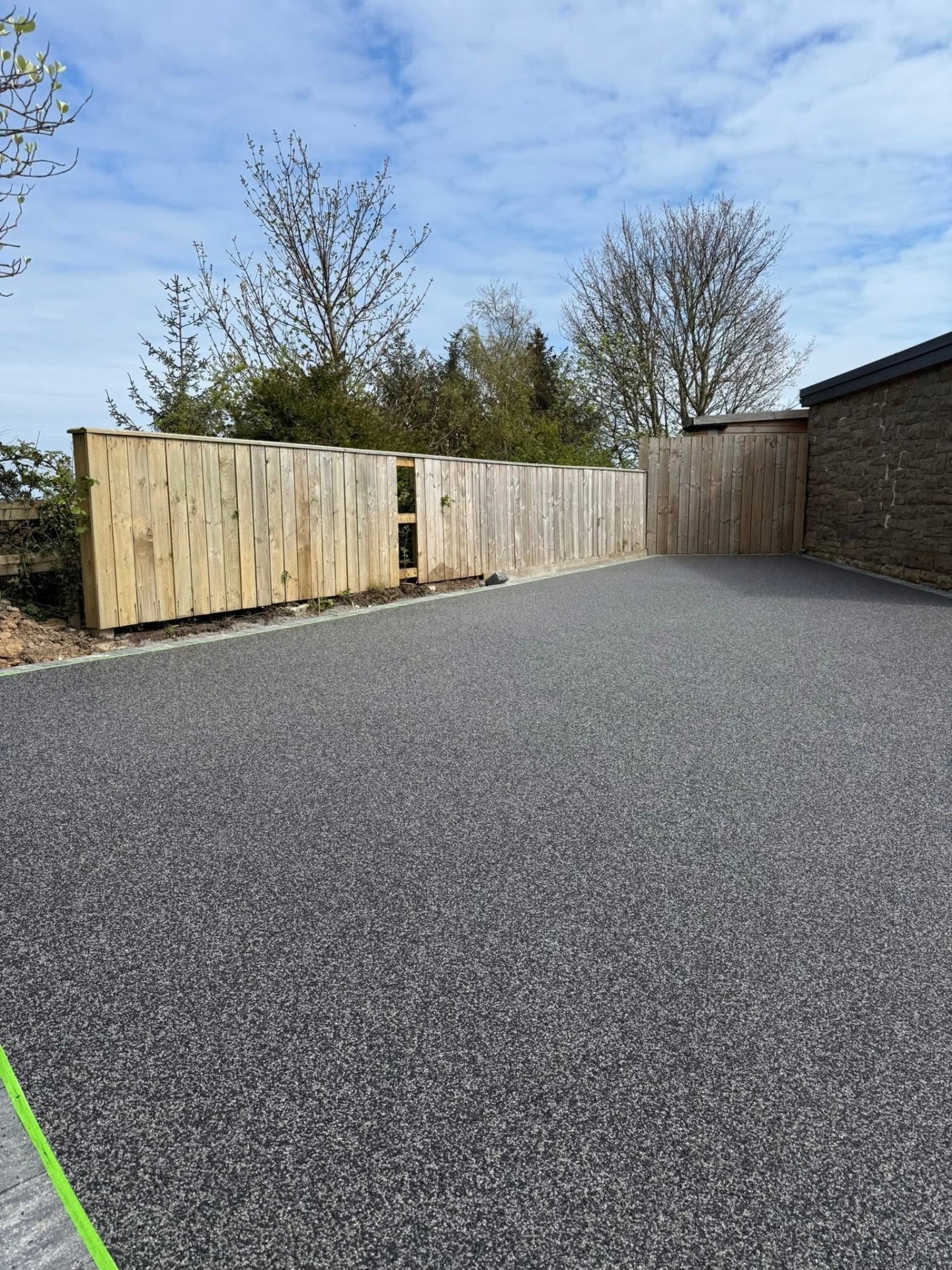 Resin bound driveway with timber fence