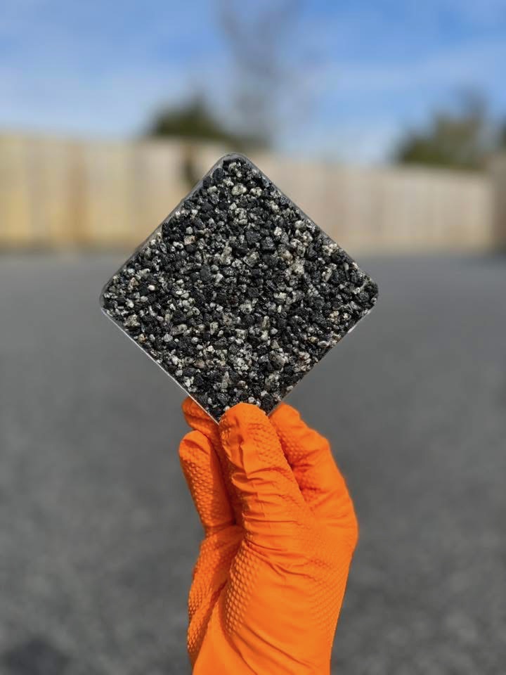 Resin bound sample tile held on site