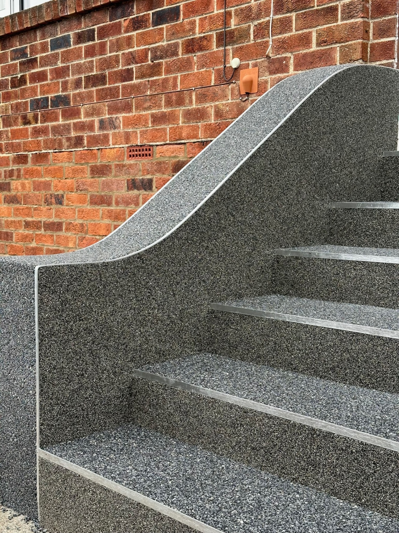 Resin bound steps with curved wall detail