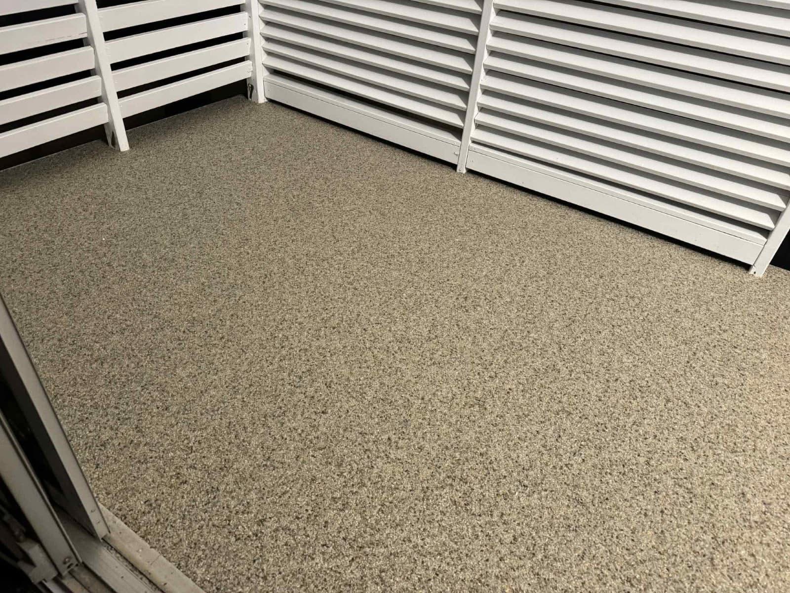Resin bound surface on balcony with white privacy screens