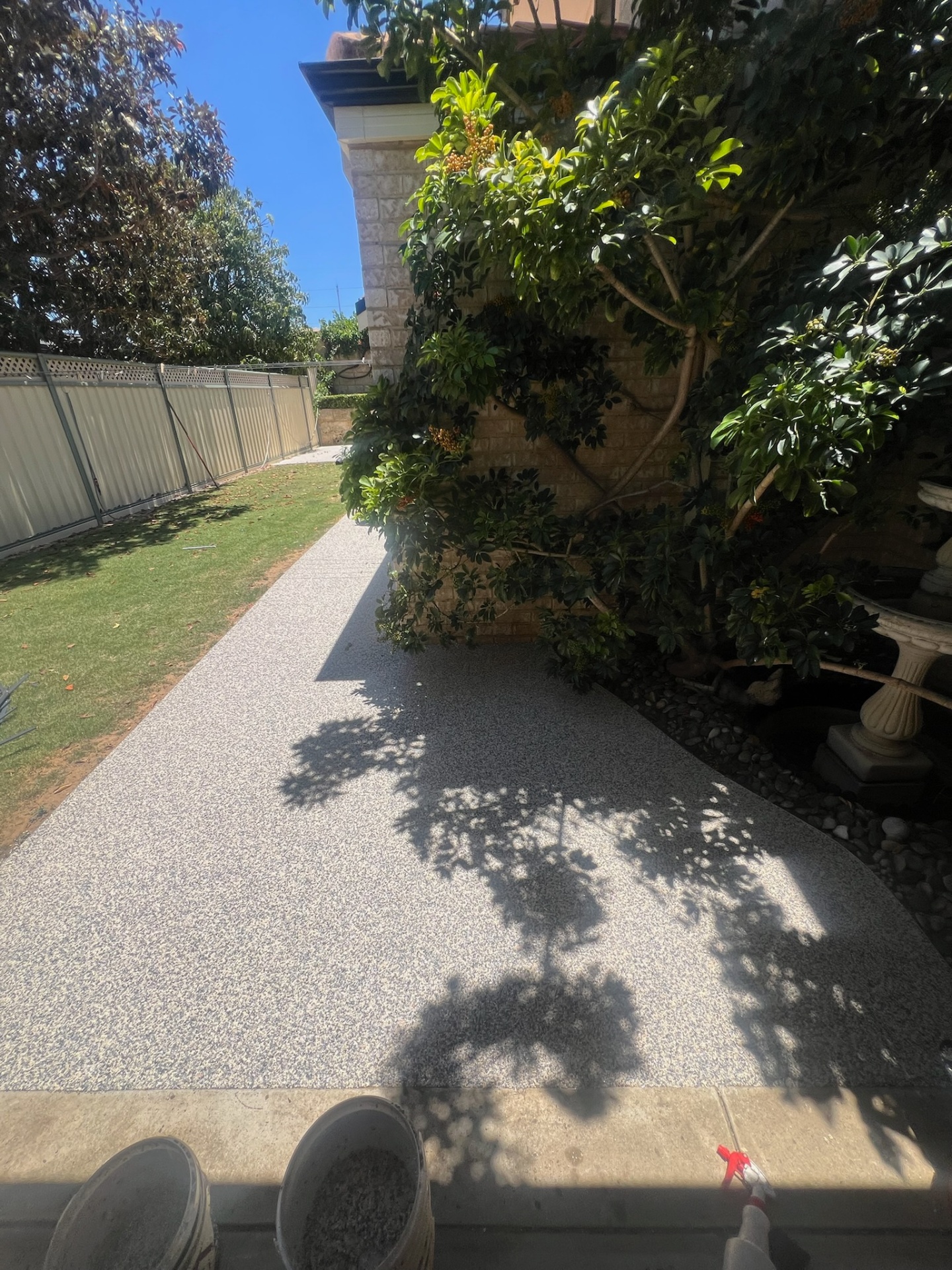Resin bound garden pathway shaded by trees