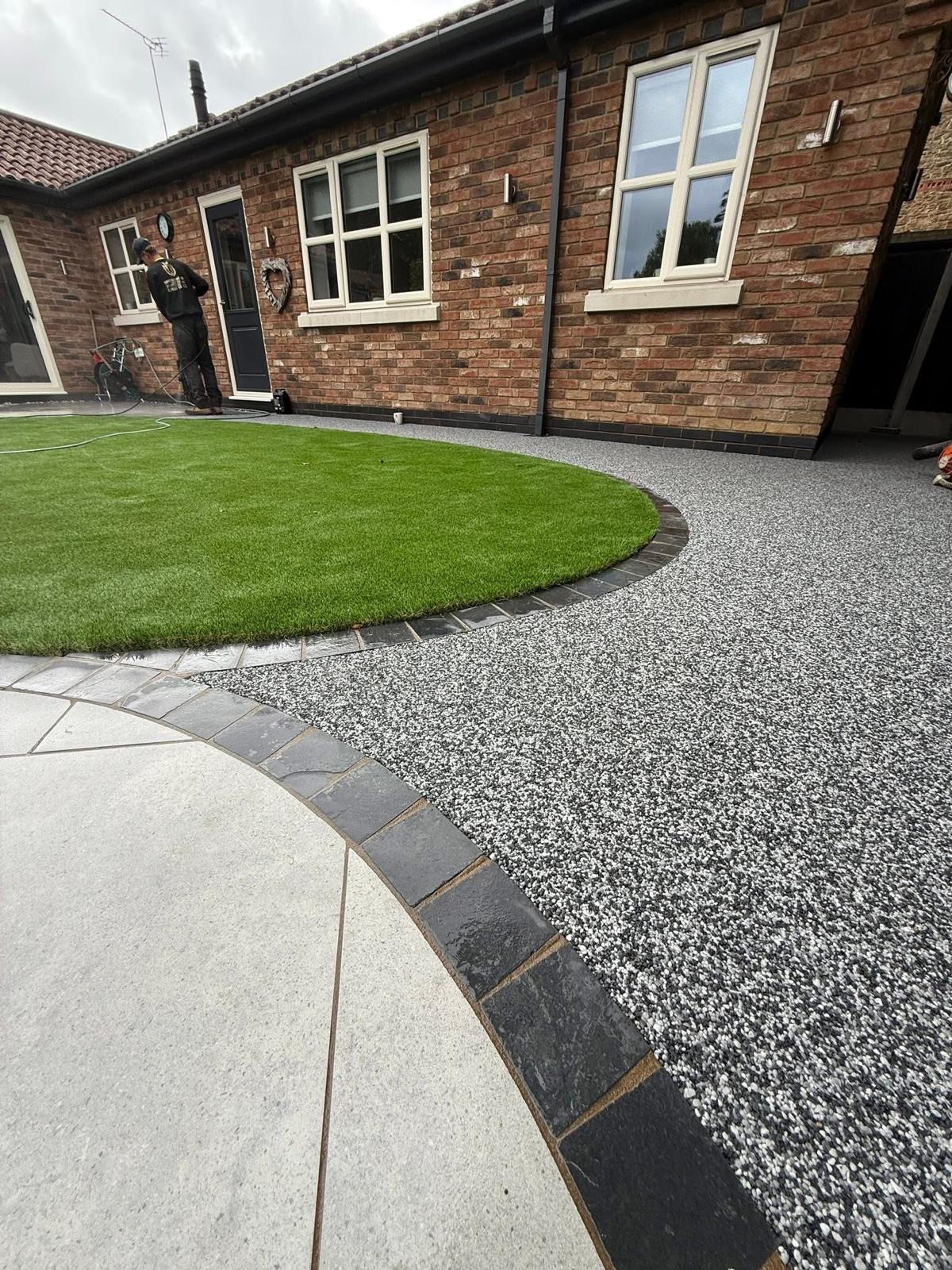 Resin bound driveway with curved lawn and patio edging
