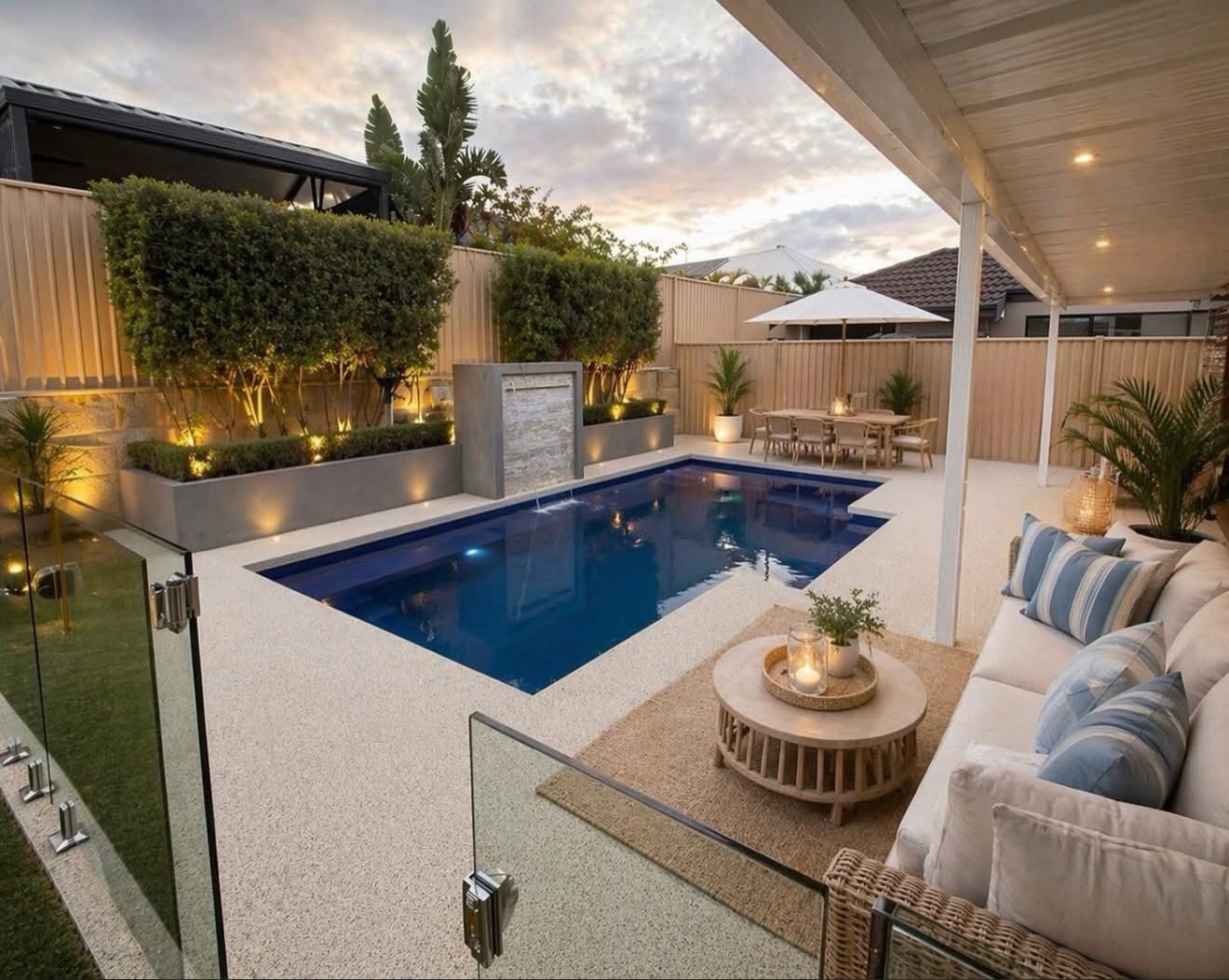 Resin bound pool surround Perth with luxury outdoor lounge and sunset views