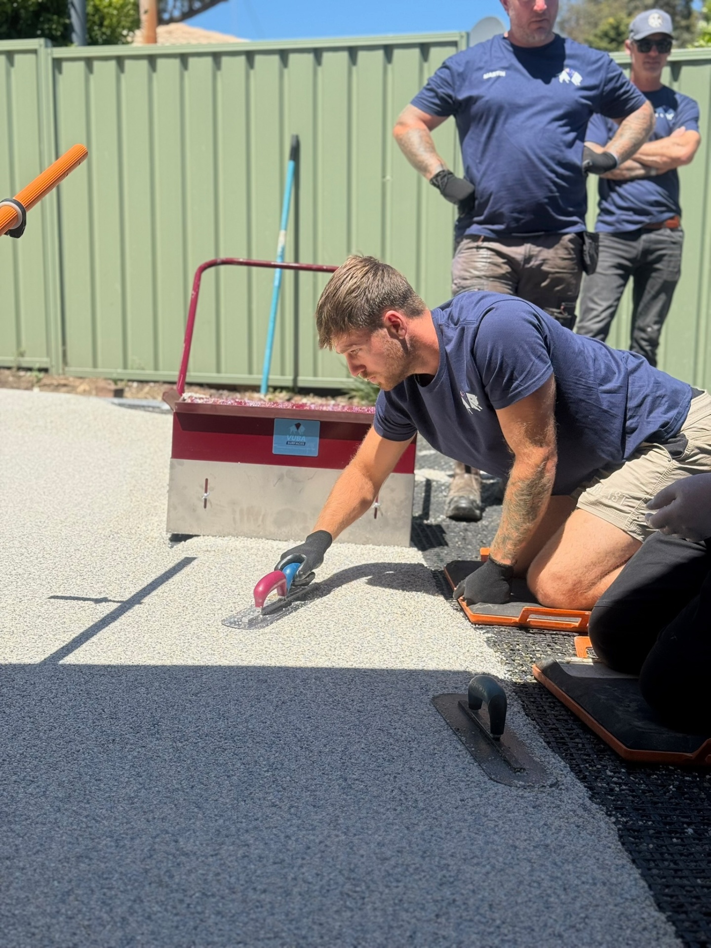 Vuba installer hand-trowelling resin bound surface