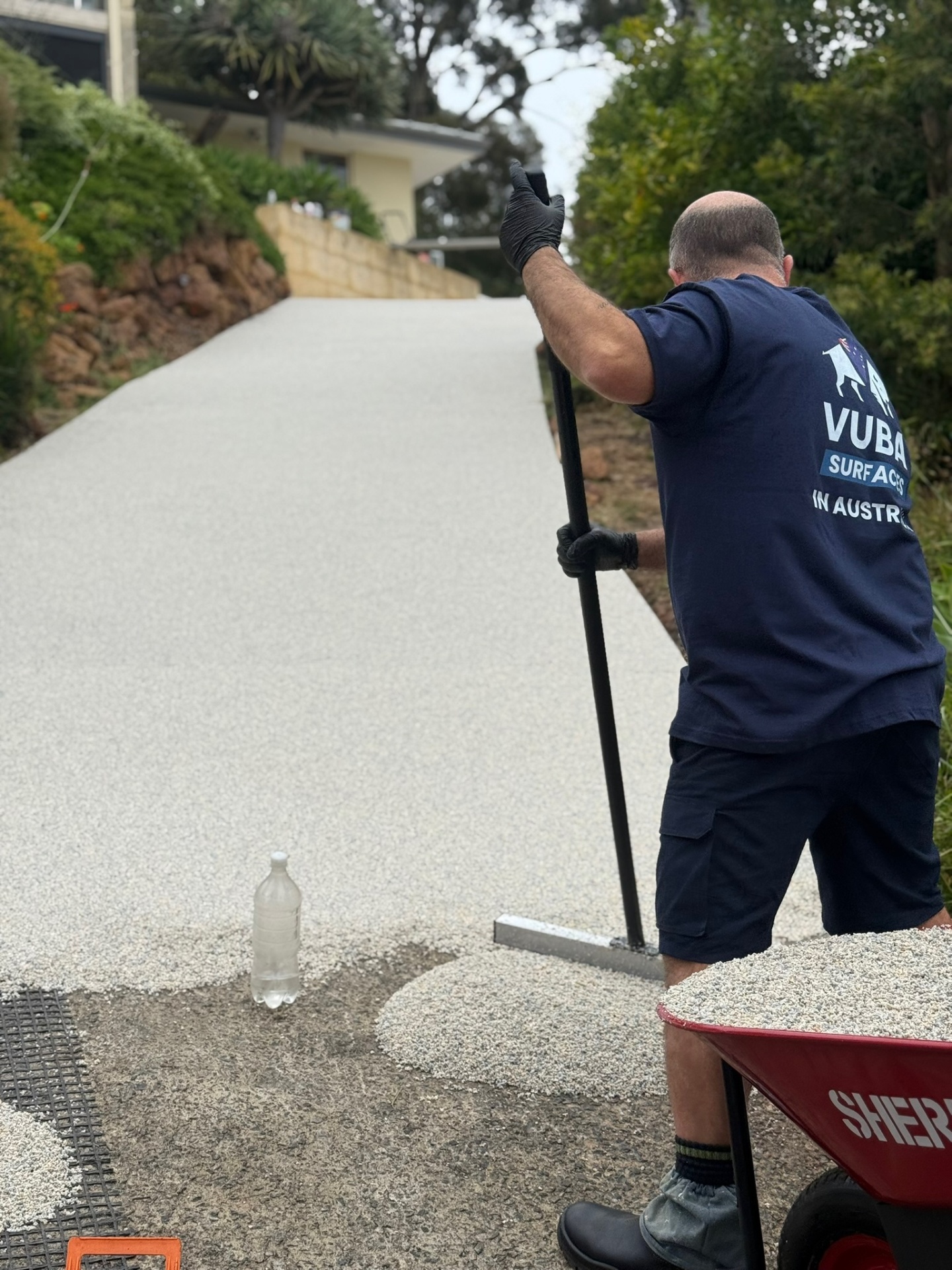Vuba installer laying resin bound driveway